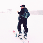 a snowboard boot bag in a snowboarders shoulder