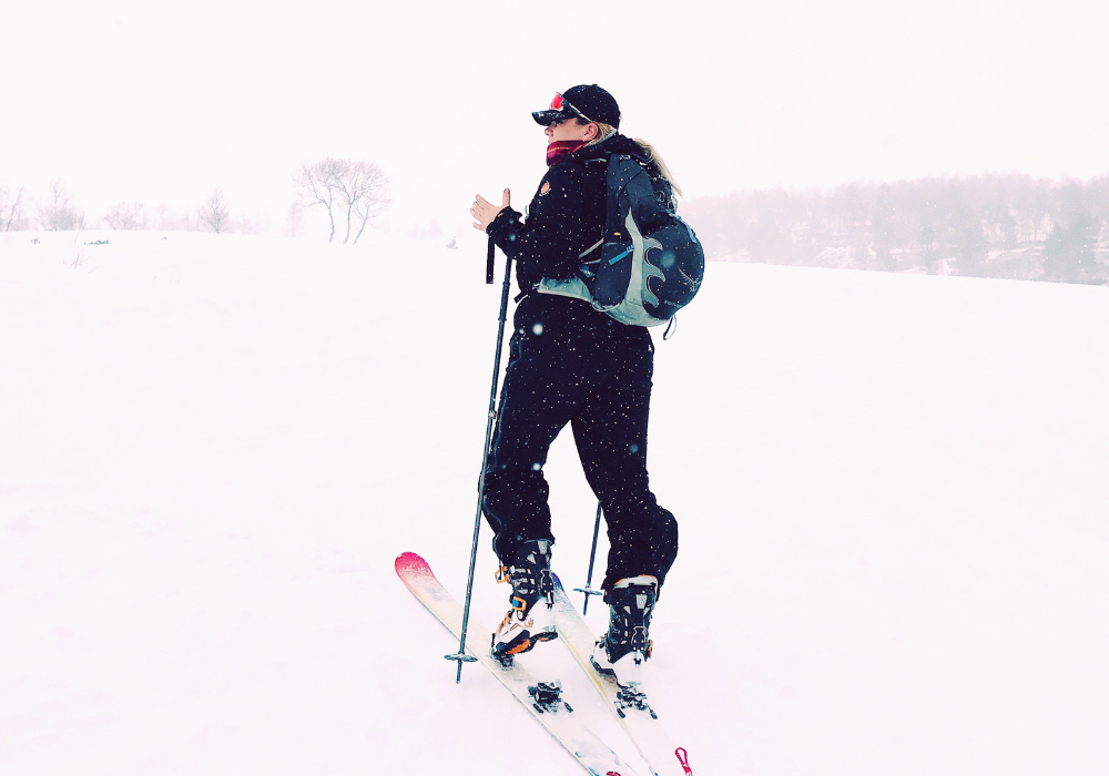 a snowboard boot bag in a snowboarders shoulder