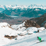 a snowboarder snowboarding on a mountain