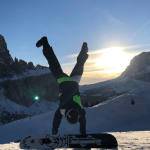 A snowboarder doing wheelie wearing womens snowboard boots